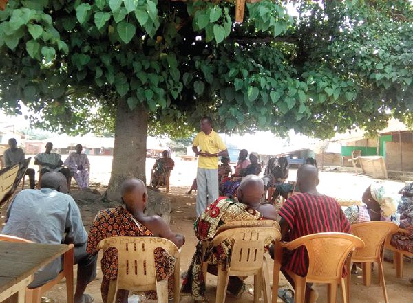 Mr Daniel Agbesi Latsu, NCCE District Director (standing) addressing participants