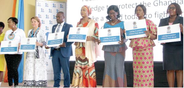 Hajia Samira Bawumia(4th right) and some dignitaries displaying the GACA Pledge at the ceremony held in Accra.Picture:ESTHER ADJEI 