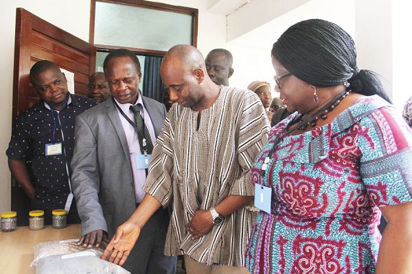 Prof. Godfred Ofosu-Budu (2nd left), Dr Sagre Bambangi (3rd left) and Dr Margaret Amoakohene (4h left), Head of Department of Communications, University of Ghana, looking at some of the soil samples on display. Picture: MAXWELL OCLOO