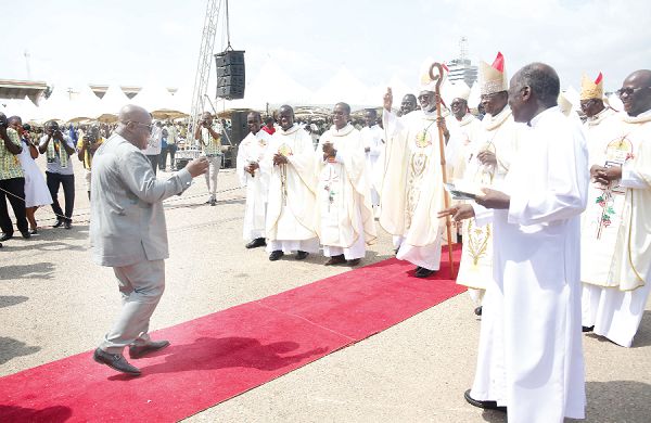President Akufo-Addo dancing to receive members of the leadership of the Catholic Church at the event. Pictures: SAMUEL TEI ADANO