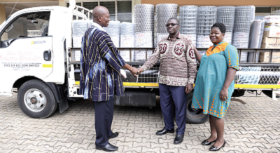 Mr Abena Kumordzi-Agbodemegbe (left) handing over the items to Mr Ernest Nyagbe, Chief Director, Greater Accra Regional Coordinating Council. With them is Mrs Yaa Boahemaa Okyere, the PRO of the Regional Coordinating Council