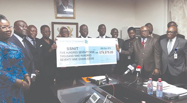  Management of SSNIT with their counterparts from Trust Hospital exhibiting the dummy cheque