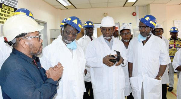 Mr John Peter Amewu (2nd left), the Minister of Energy, and Mr Isaac Osei (2nd right), the MD, Tema Oil Refinery, being briefed on the operations of the refinery during the tour. With them include Mr John Boadu (right), Board Member, TOR 