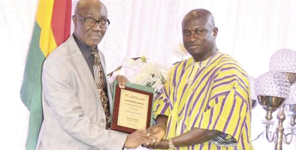  Mr Moses Armah (right) receiving his award