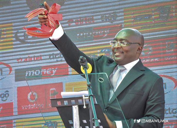 Vice-President Dr Mahamudu Bawumia (right) launching the second phase of the Mobile Money Interoperability platform at a ceremony in Accra