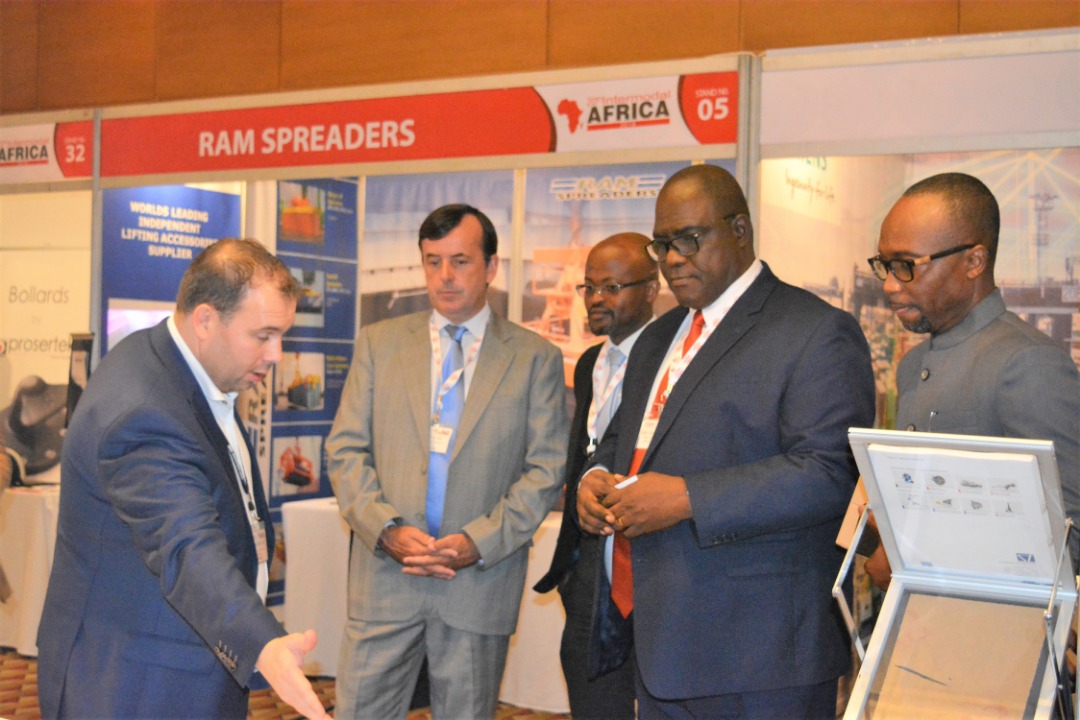 Daniel Hoffmans of Faiveley Power, an exhibitor of port equipment explaining a point to Captain Ebenezer Afenyie-Dadzie (2nd right), Director of Takoradi Port. With them are Mr Kwabena Ofosu-Appiah (R), President of GIFF, Alex Atakorah of Amaris Terminal and Rory Doyle of Transport Events