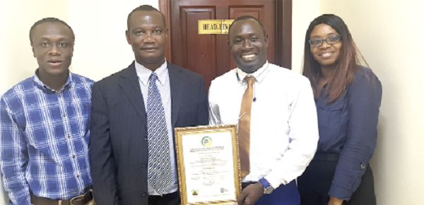 From left: Mr Kwasi Ackonor, Design Manager; Mr Francis Osei, Director of Finance; Mr Kenneth Ofori, Administrative Manager; Mr Amina Quaino, Assistant Design Manager of Devtraco Limited with the certificate