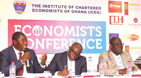 Dr Baffour Awuah (left), Special Advisor to the Minister for Special Development Initiatives making a point. Those with him are Mr Daniel Addo (middle), Chairman for the occassion and Prof Tuffou Asubonteng (right), President - ICEG. Picture: NII MARTEY M. BOTCHWAY