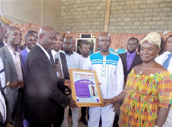 Elder Elvis Kwaku Appiah Attafuah (left) presenting a citation to Deacon Donkor