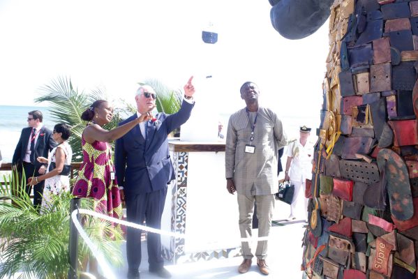  Ms Constance Swaniker (3rd left), Chief Executive Officer of  Accents and Arts, explaining a point to the  Prince of Wales, Prince Charles (2nd right), during a visit to Sandbox near Labadi Beach  in Accra. Picture: GABRIEL AHIABOR