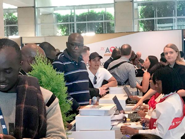 Mr Egbert Faibille Jnr registering for the conference