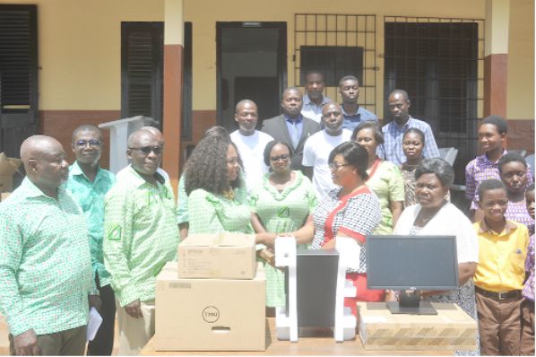 • Mrs Eva Andoh-Poku (3rd left) presenting the items to Mrs Ahumah Djietror. Looking on are some officials of the company, students and staff of the school. Picture: EBOW HANSON