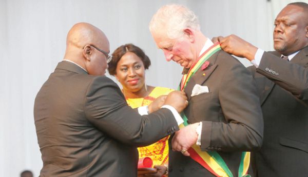  President Nana Addo Dankwa Akufo-Addo (left), decorating Prince Charles at the dinner held in his honour.