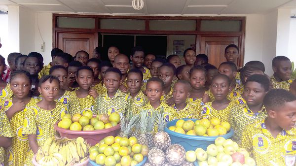   Students of the Bethel Methodist School with some of the fruits they presented to the Tema General Hospital.