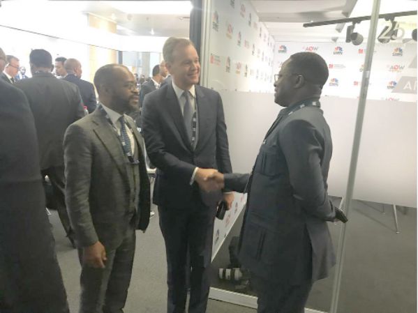 • Mr John Peter Amewu interacting with some delegates at the Africa Oil Week