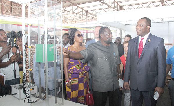  Dr Kofi Korsah (2nd left), Organising Chairperson of the TVET skills competition, showing an elevator built by some beneficiaries of the programme to Dr Matthew Opoku Prempeh.  Picture: BENEDICT OBUOBI