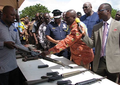Mr Jones Applerh (middle), the Executive Secretary of the Small Arms Commission stressing a point during the burning of small arms at the Police Depot in Accra. Picture: ESTHER ADJEI