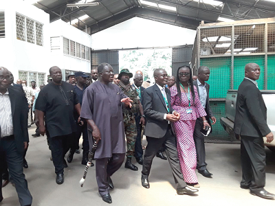 Otumfuo Osei Tutu II leading the team to inspect the extent of damages to property at the university