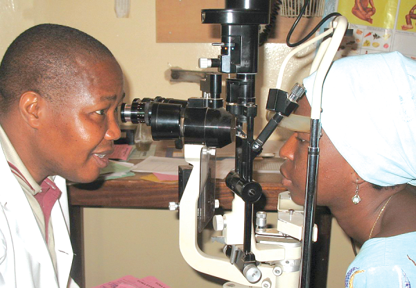 An ophthalmologist attending to a patient