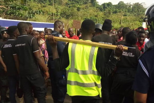 Policemen preventing the demonstrators from entering Newmont Akyem premises