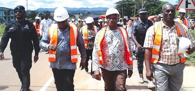  Mr Kwasi Amoako-Atta (2nd left) the Roads and Highways Minister, with his entourage on the Kwafokrom - Apedwa section of the Accra-Kuamsi highway after he had cut the sod for the dualisation of the road