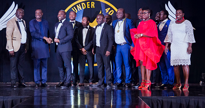 Dr Ibrahim Awal (2nd left) congratulating Dr Kofi Amoah Abban, after presenting to him his award. With them is Mr Richard Abbey