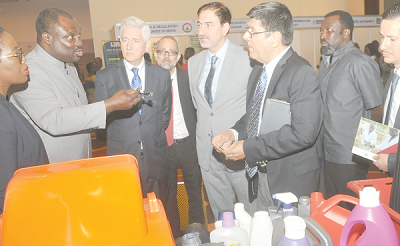 Mr Robert Ahomka-Lindsay, Deputy Minister of Trade and Industry, interacting with some officials from UNIDO during an exhibition mounted as part of the UNIDO 10th anniversary trade meeting at Qualiplast Limited stand. Among them is Mr Fares Akl, (3rd right), the MD of Qualiplast Limited. Picture: EBOW HANSON