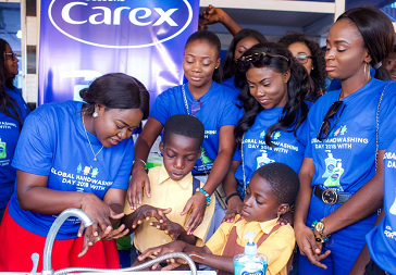 Ghana's Most Beautiful contestants with Dr Emelia Ababio teaching handwashing with Carex handwash on Global Handwashing Day