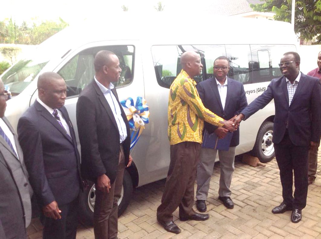  The Regional Chief Financial Officer of Newmont, African Region, Mr Kwame Addo-Kufuor (right) handing over the keys to the vehicle to Mr Hohoabu 