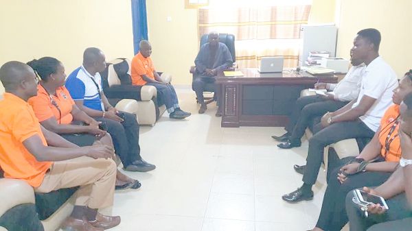  The SSNIT team, led by Mr Adzor (3rd left), interacting with the Principal, Prof. Amin Alhassan (head of table) during the ceremony
