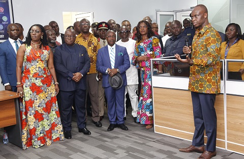 Mr Joe Anokye (right), Director General, NCA, explaining a point to President Akufo-Addo (2nd left), after the commissioning of the NCA-CERT and the Common Platform in Accra. Looking on is Mrs Ursula Owusu-Ekuful. INSET: A screen displaying the common platform at the ceremony. Pictures: SAMUEL TEI ADANO
