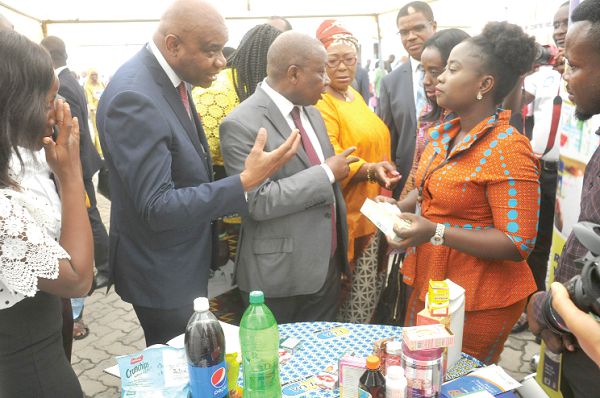  Ms Rachael Asantewaa Ntow (right), an official of the FDA, explaining the functions of some approved drugs to the dignitaries during an exhibition mounted as part of the forum. Among them are Mr Kwaku Agyeman-Manu, Minister of Health; Prof Stanley Okolo (left), Director General of WAHO, and Dr Moeti Matshidiso, Regional Director of WHO. Picture: EBOW HANSON