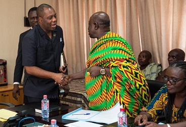 The Education Minister, Matthew Opoku Prempeh (left) exchanging pleasantries with Nana Effah Apenteng, the IMC Chairman, KNUST.