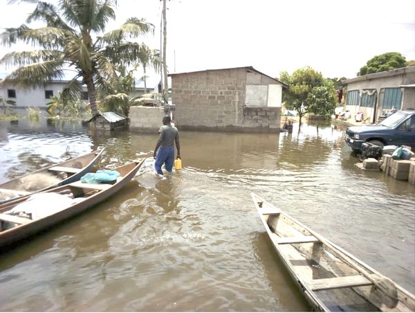  Some residents wading through the floods