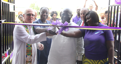 Sir Sam Jonah KBE (3rd left), cutting the tape to inaugurate the school. Assisting him are Rev. Fr Andrew Campbell (left), Mr Francis Poku (2nd left), Ms Cornelia Boateng (right) and Lord Paul Boateng (2nd right)