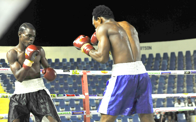 Theophilus Tetteh (left) proved too strong for Joshua Barnor in their super welterweight contest