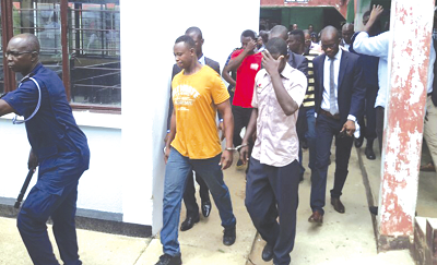 Some of the eight members of the Delta Force leaving the court premises