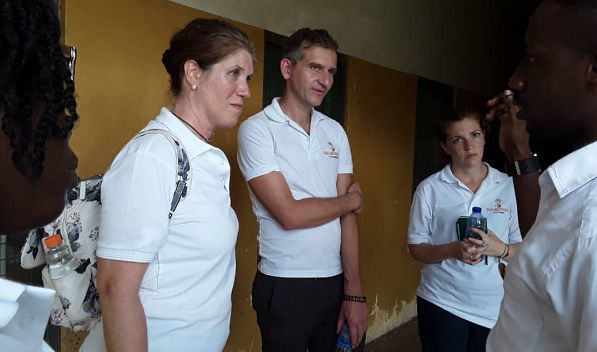 The UK team with Dr Attard in the middle and Ms Bolton (left) and Ms Fontelo being briefed on their tour of the Ankaful Psychiatric Hospital