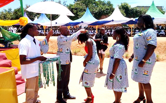 Mr Krobea decorating some of the graduate nurses with their medal