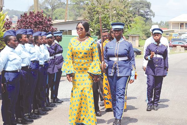 Mrs Cynthia Mamle Morrison inspecting a guard of honour mounted by the students of Aburi Girls
