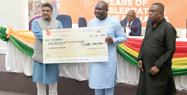 Mr Birender Yadav (left), the Indian High Commissioner in Accra, presenting the cheque for the $1 million grant to Mr Vincent Sowah Odotei (2nd left), Deputy Minister of Communications. With them is Mr Kwasi Adu-Gyan, Director-General, AITI-KACE in Accra. Picture: EMMANUEL ASAMOAH ADDAI   