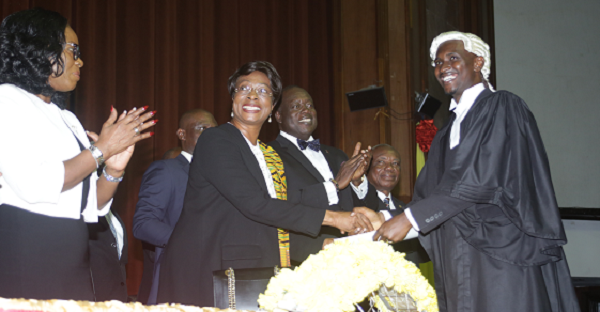 Chief Justice Sophia Akuffo, (2nd left),  presenting the John Mensah Sarbah award to  Mr Jainie Agovi  at the event.