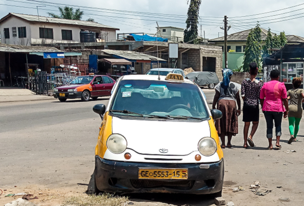 The abandoned taxi after the driver fled the accident scene