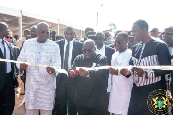 President Nana Addo Dankwa Akufo-Addo cutting the tape  for the inauguration of the power plant, with the support of President Roch Marc Christian Kabore (left) of Burkina Faso
