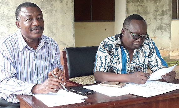 Mr Frank Nunoo (left) addressing journalists. With him is Mr Charles Damoah also at the EC Office, Sunyani.