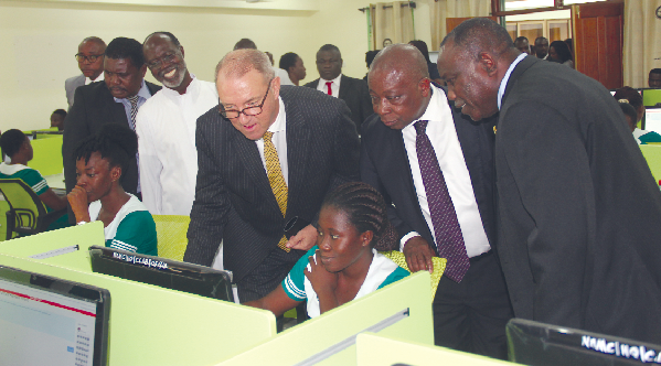 Mr Felix Nyante (right), Mr Kwaku Agyemang-Manu (2nd right), Mr Ronald Strikker (3rd right), The Netherlands  Ambassador to Ghana, observing a candidate going through the examination during a visit to the centre. Picture EDNA ADUSERWAA