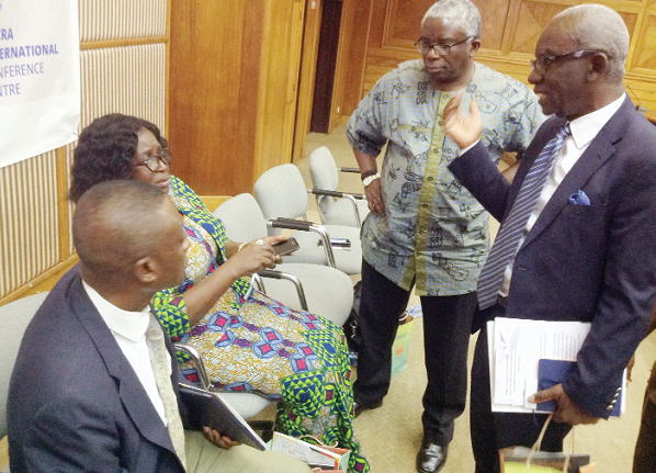 The President of the GBPA, Mr Elliot Agyare (right), chatting with Mr Richard Crabbe (2nd right), a former President of the association; Mrs Felicia Boakye-Yiadom of the National Curriculum and Assessment Council and Mr James Appiah Berko (left), President of the Ghana Printers and Paper Converters Association, after the event. Picture : Nana Konadu Agyeman	