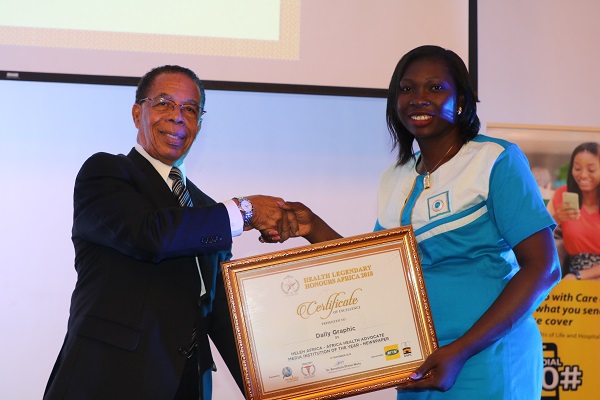 Mrs Gertrude Ankah Nyavi receiving the award on behalf of Daily Graphic