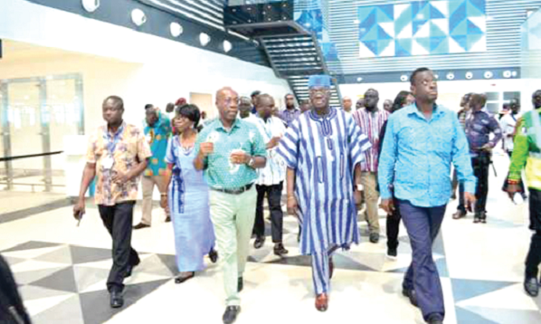 The Minister of Aviation, Mr Kofi Adda, (2nd from right) being conducted on the tour by the Managing Director of the GACL, Mr John Attafuah (3rd from left)