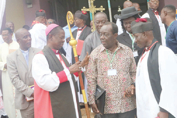 Most Reverend Professor Daniel Yinkah-Sarfo (2nd left), the Anglican Bishop of Kumasi, in a chat with Dr Kwame Addo Kuffour (2nd right), the Board Chairman of SSNIT, after the event at the St Cyprian's Cathedral in Kumasi. Picture: EMMANUEL BAAH